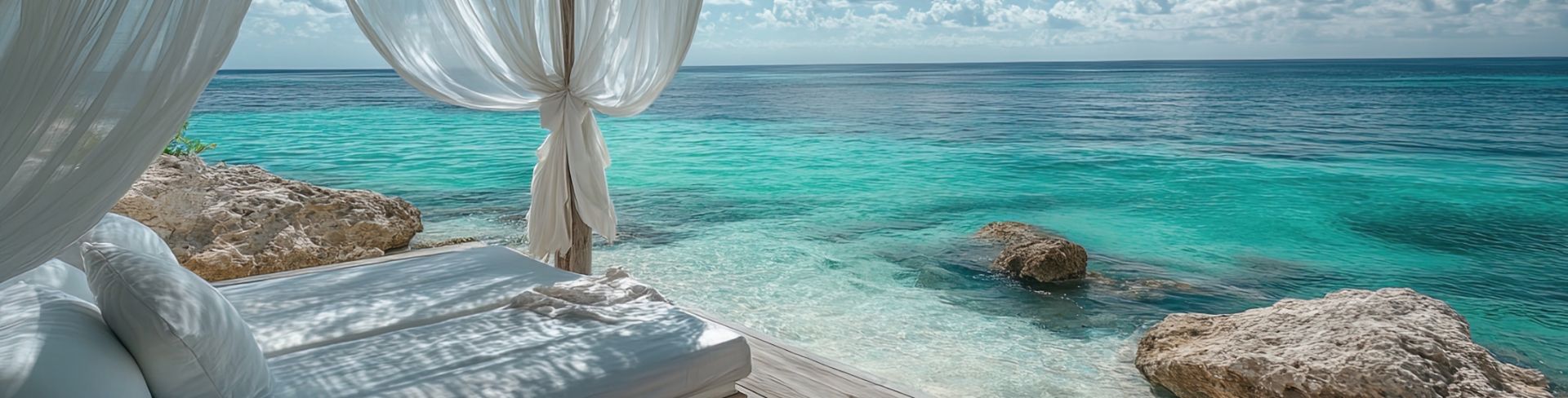 A cabana sits beachside overlooking bright blue waters.