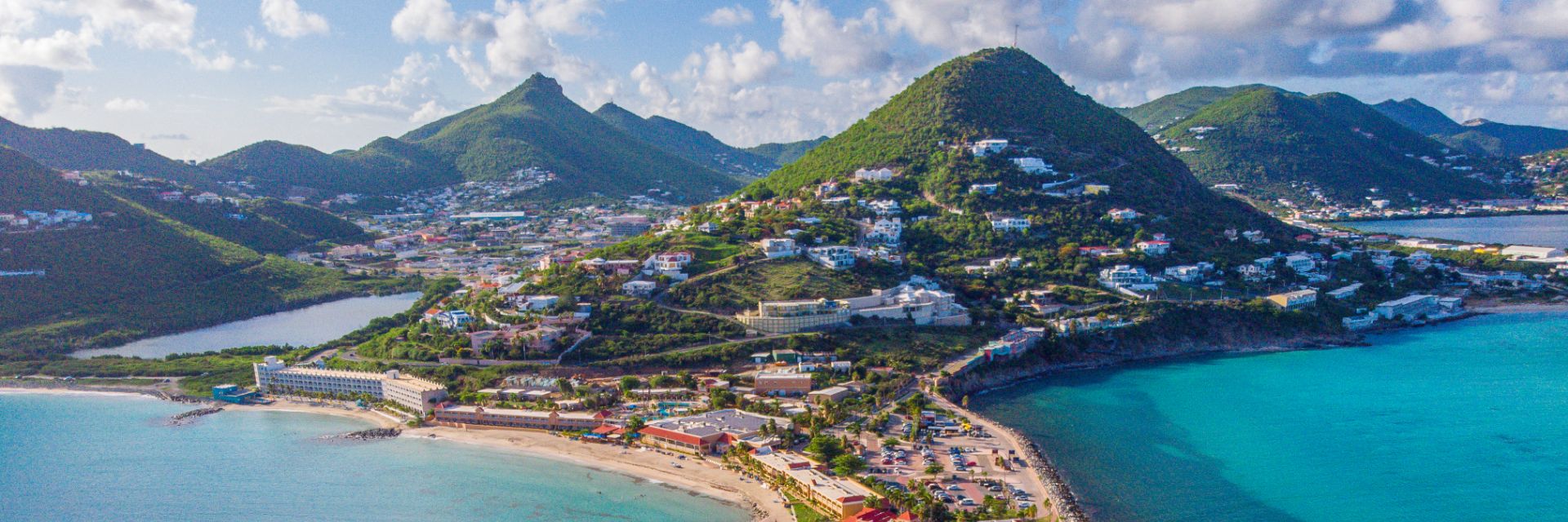 Water surrounds a mountainous stretch of land.