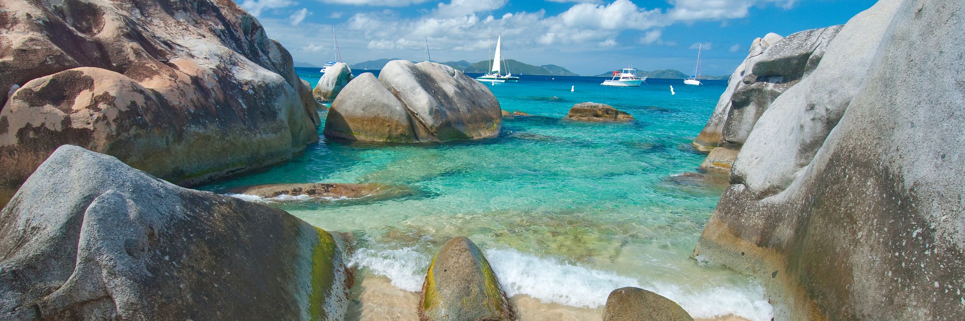 Waves crash on a rocky beach. 