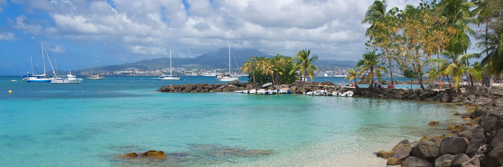 Crystal clear waters meet a sandy coastline.