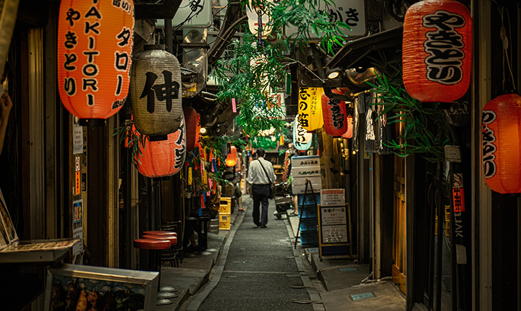 Paper lanterns line a quiet street.