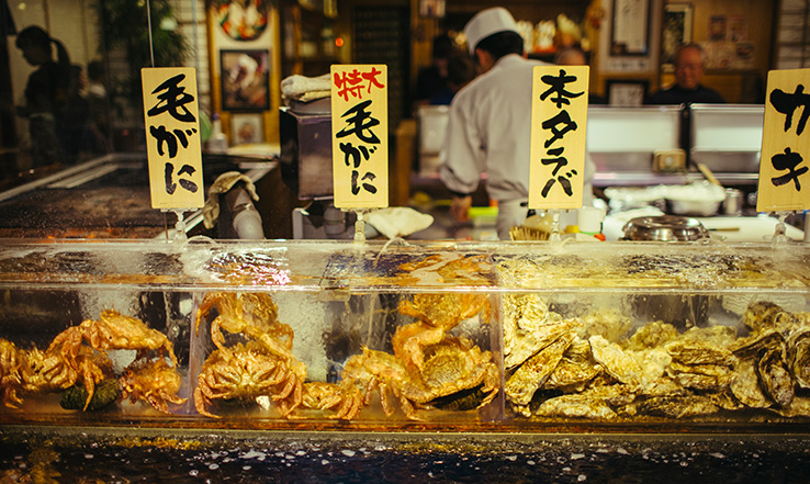 Different types of seafood for sale in a market.