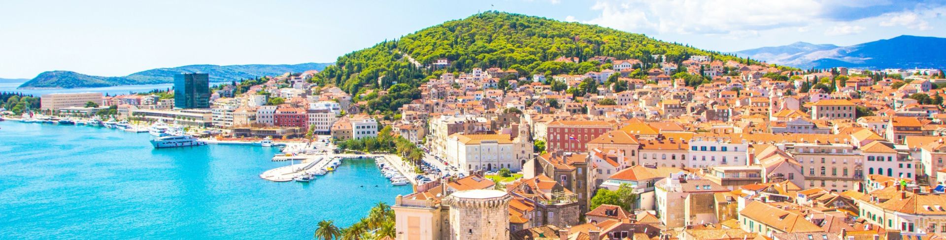Terracotta rooftops fill a peninsula. 