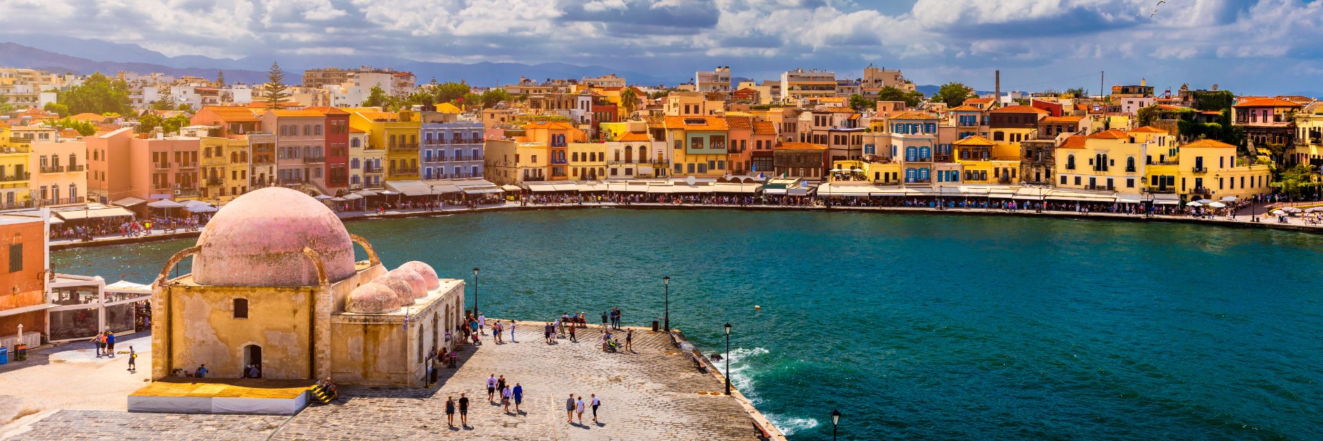 Bright blue skies backdrop a waterfront town. 