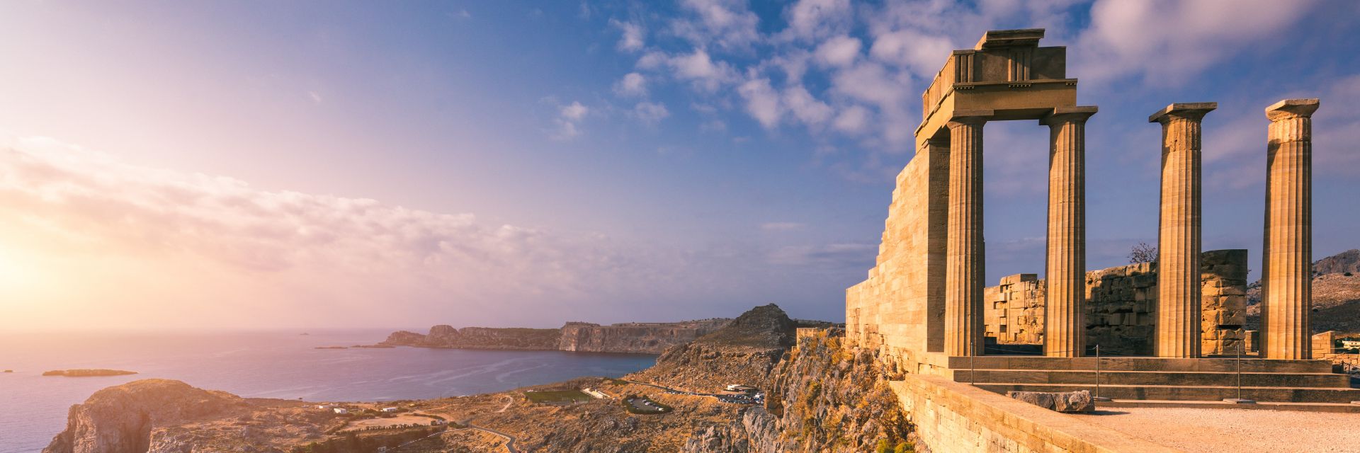The sun shines down on ancient ruins.