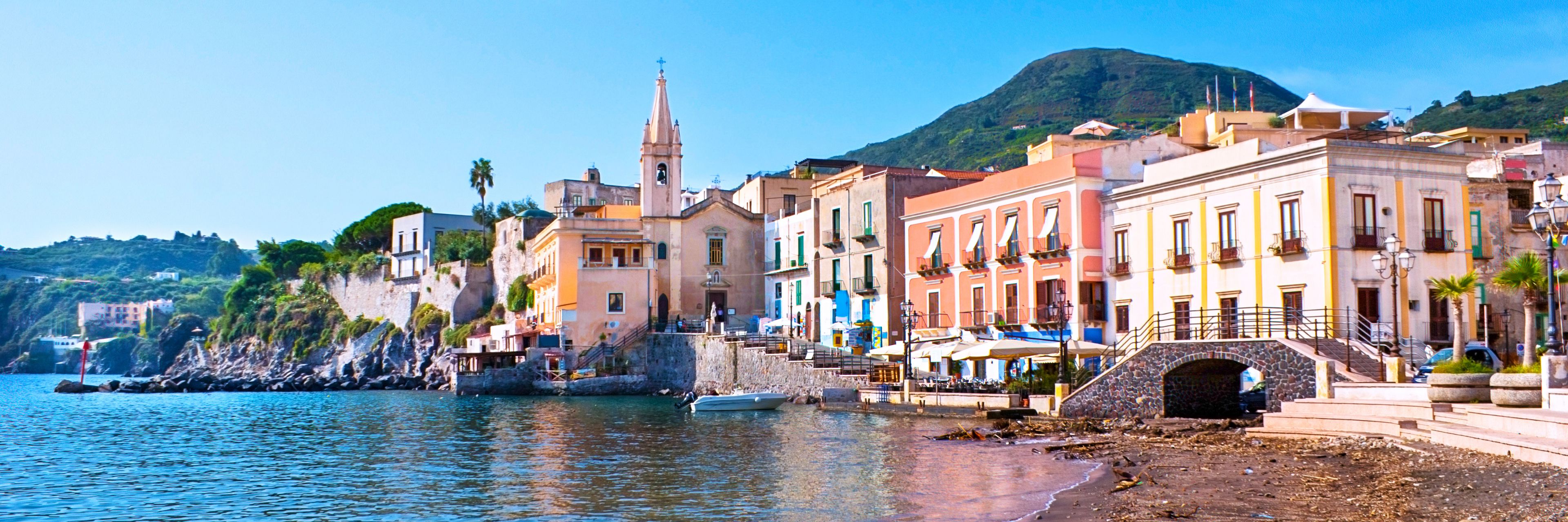 Buildings line the coastline in Lipari, Italy.