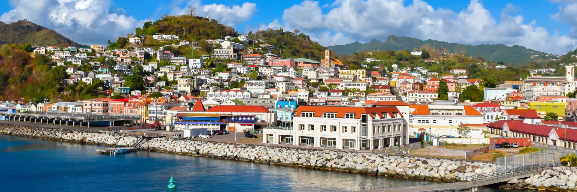 Bright white buildings line a clean coastline