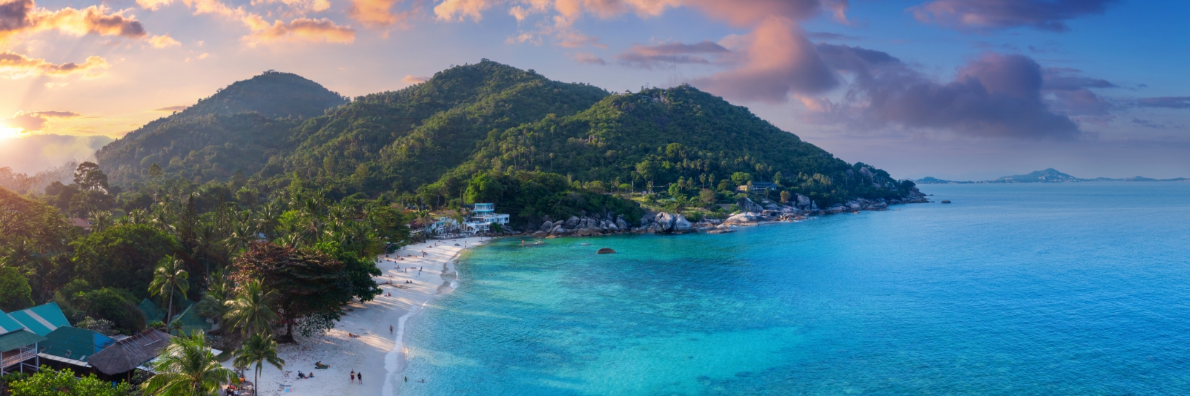Beach with mountains in background. Singapore to Hong Kong. 
