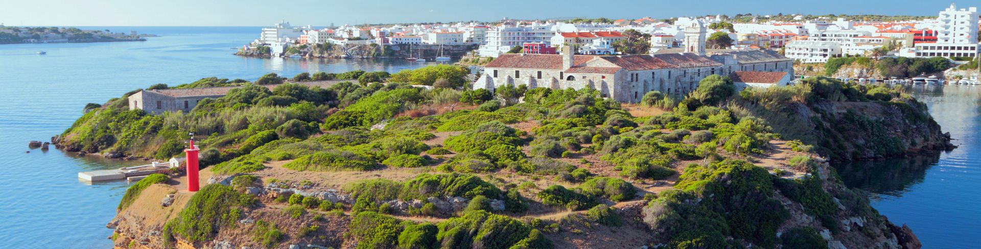 Balearic Island with city on it, surrounded by water.