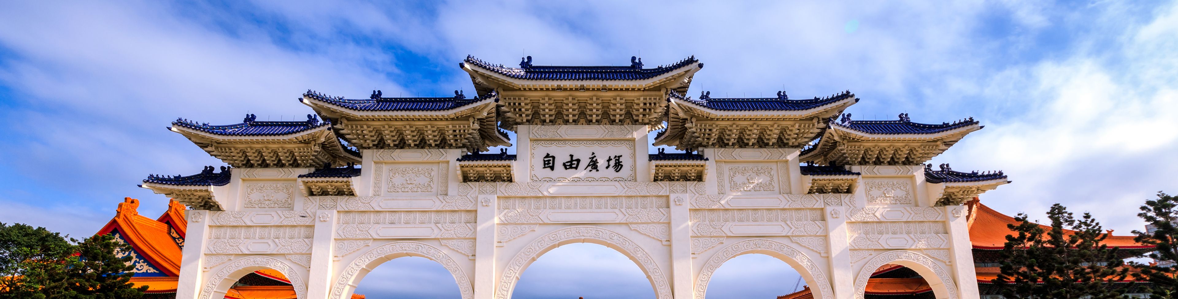 Pillars showing a temple behind them. 