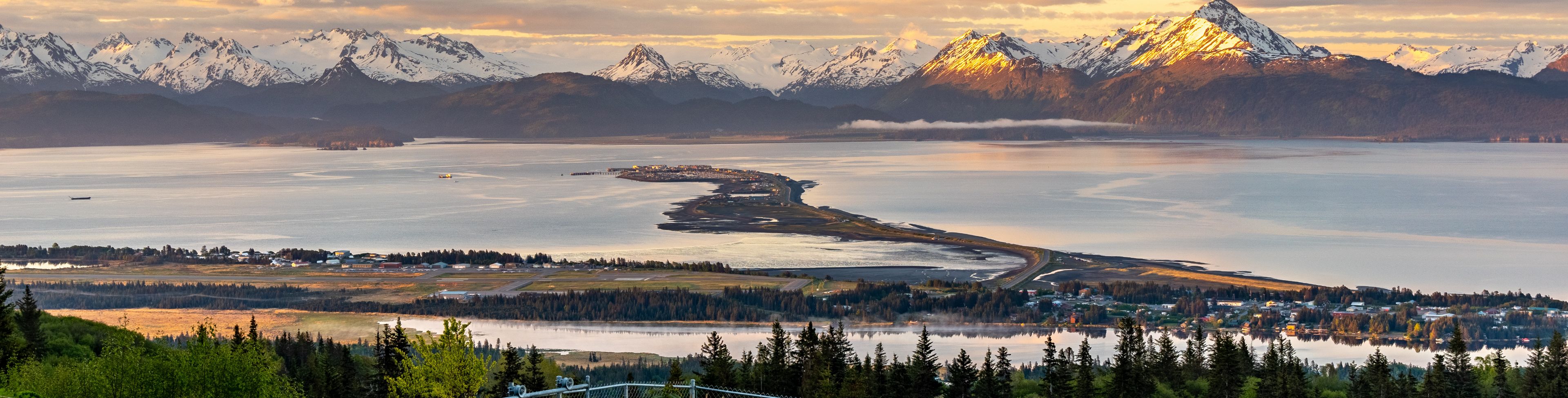 View of the mountains and water at sunrise.