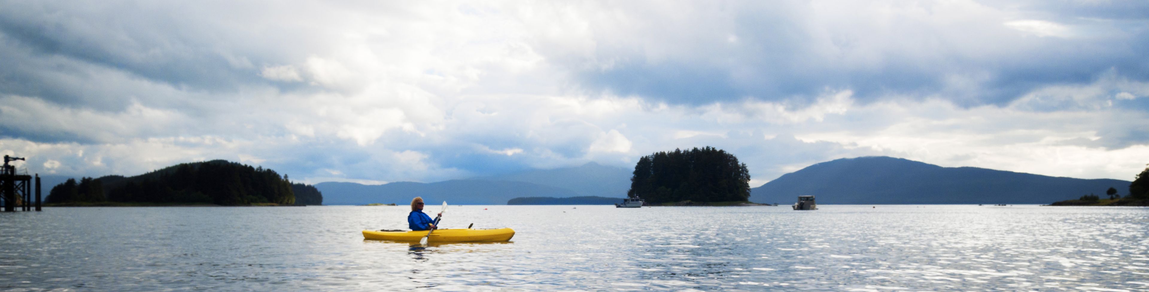 People kayaking on a River Hatchery and Lake.