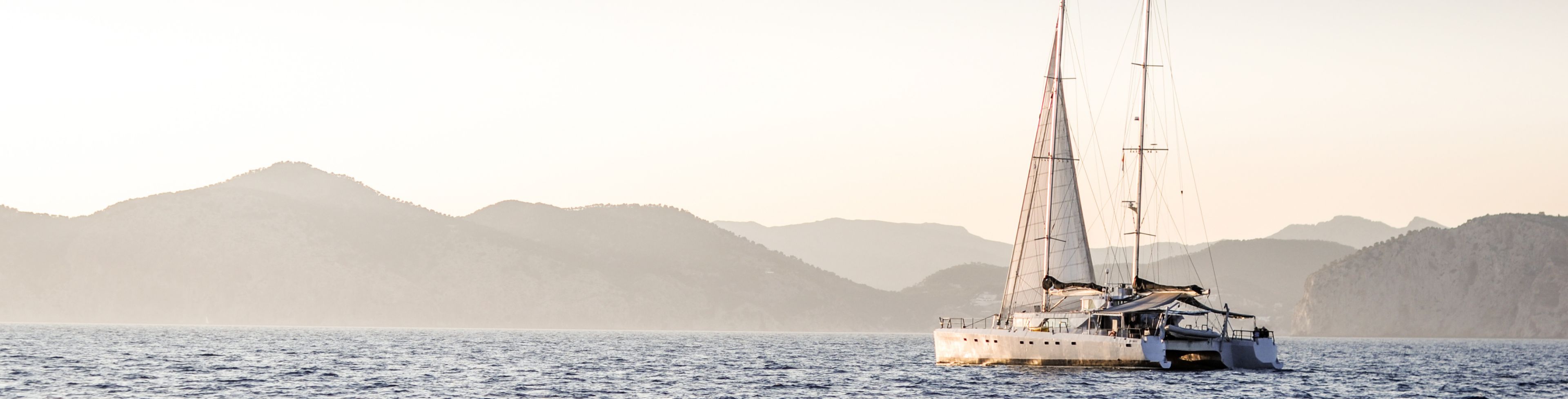 Sail boat on open water. 