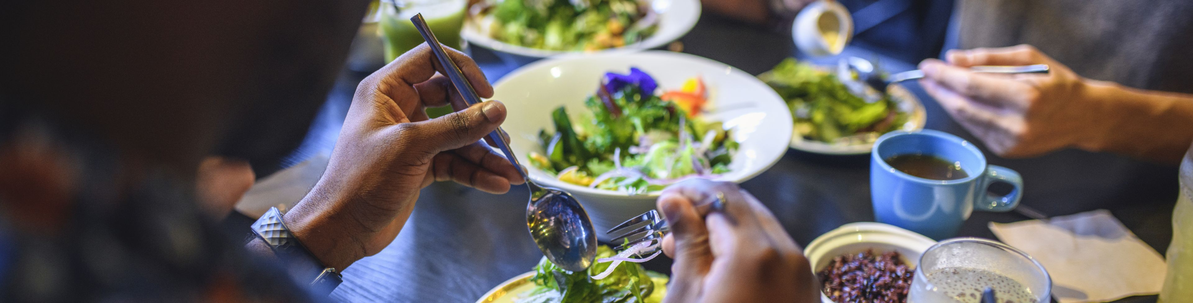 People eating at a table together. 