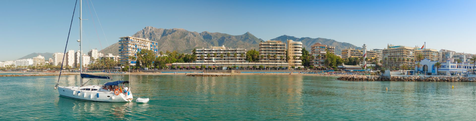 Sail boat anchored in the ocean. 