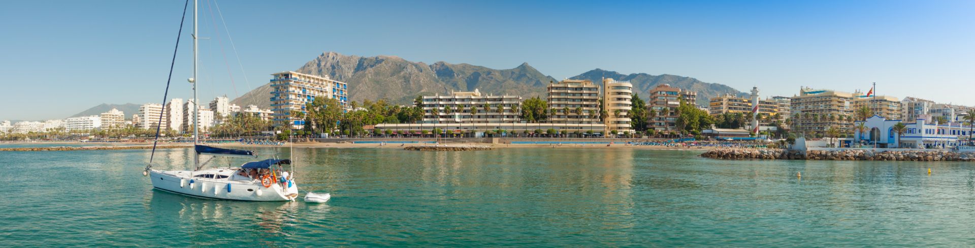 Sail boat anchored in the ocean. 
