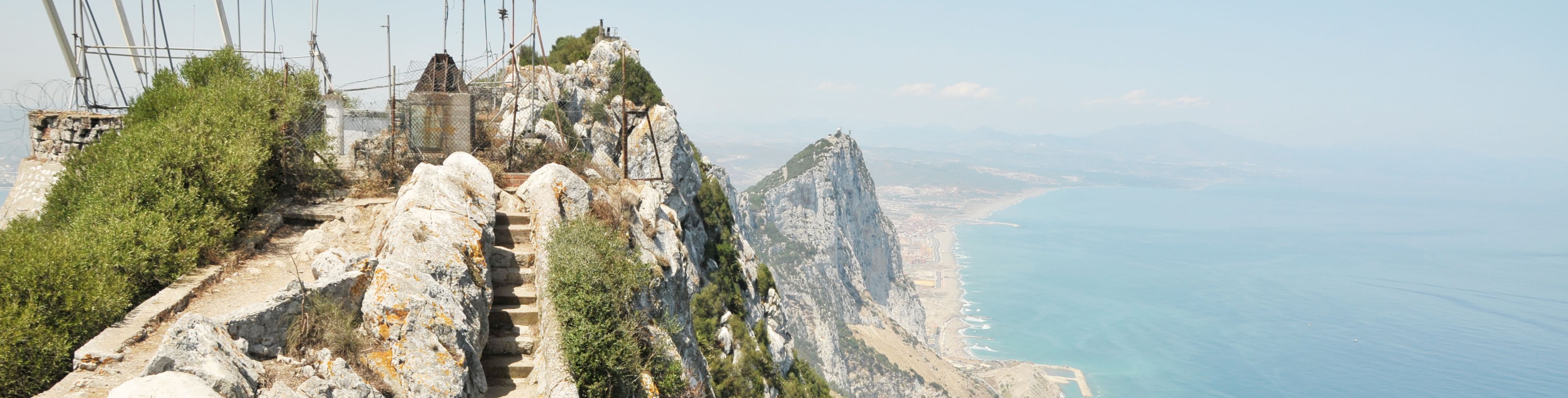 Stone stairs built into the side of a mountain, leading to the top. 