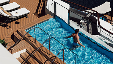 Man in a pool on a yacht. 