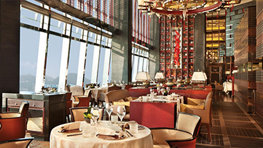 Dining hall with empty seats and set tables. 