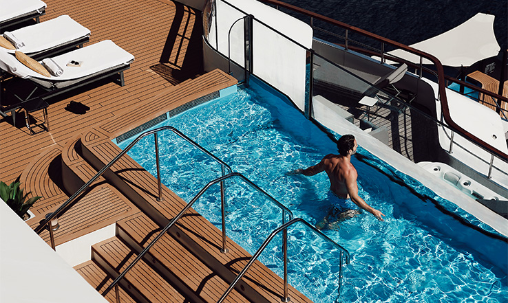 Man in a pool on a yacht. 