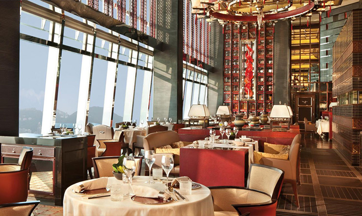 Dining hall with empty seats and set tables. 