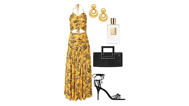 Outfit items for a woman, long sundress, high heels, perfume, earrings, and purse. 