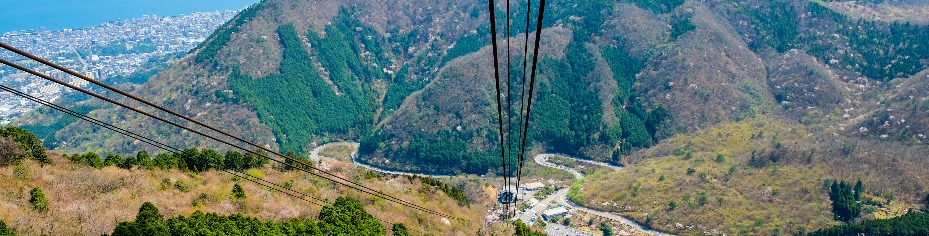 Aerial view of a valley and mountains in the distance. 