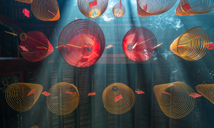 Paper lanterns hanging from a ceiling. 