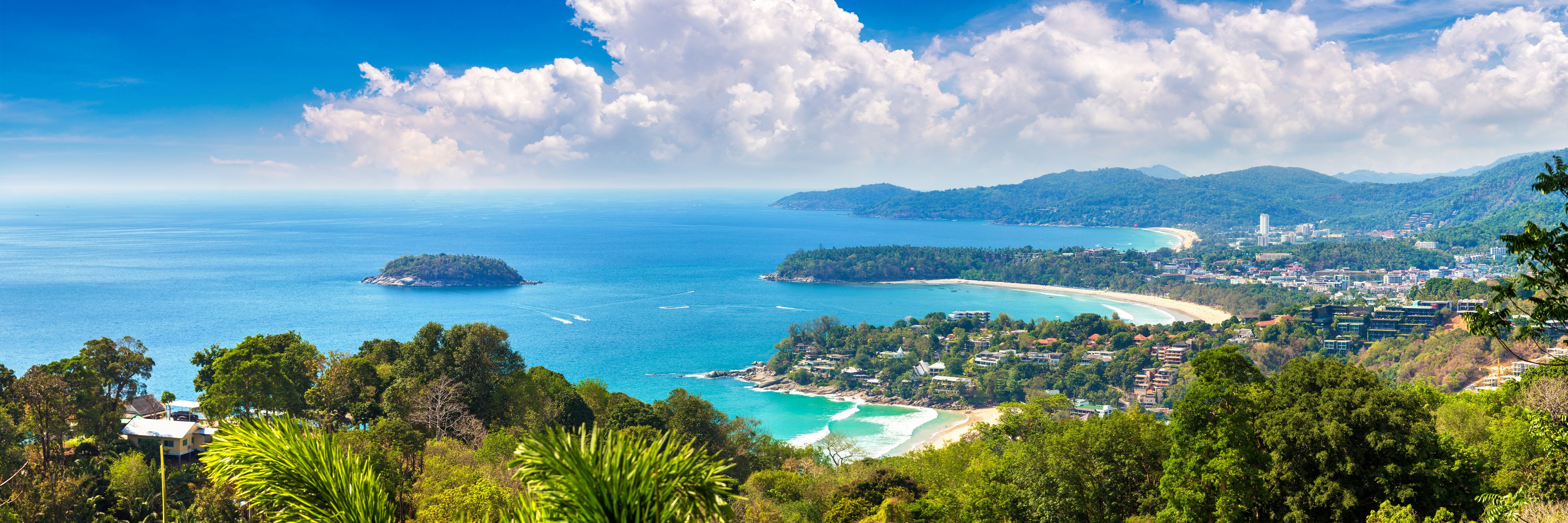 Mountain view of island and ocean in the distance and below. 
