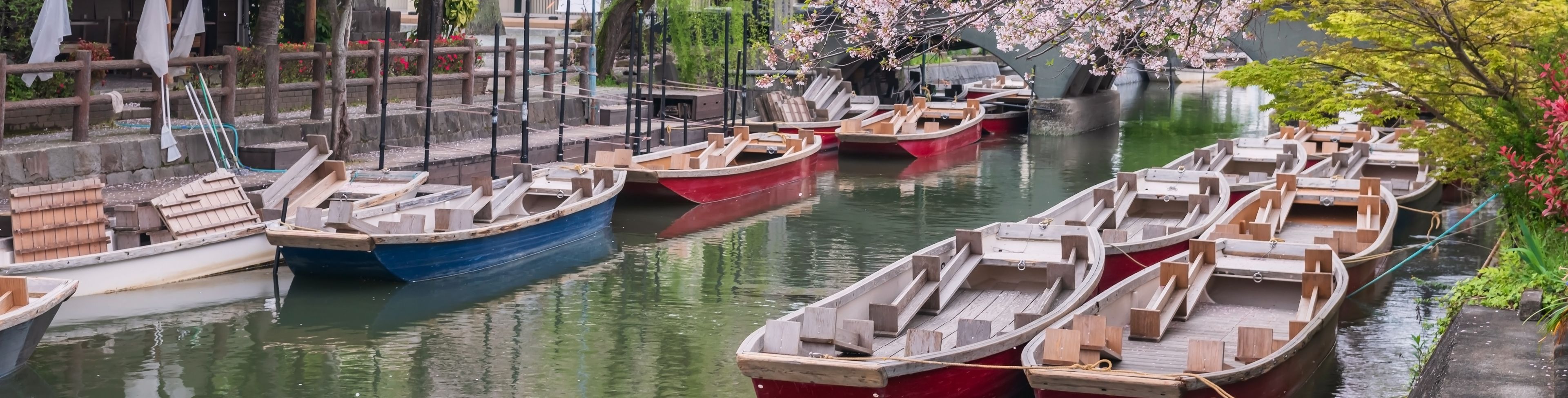 Boats anchored along a ravine. 