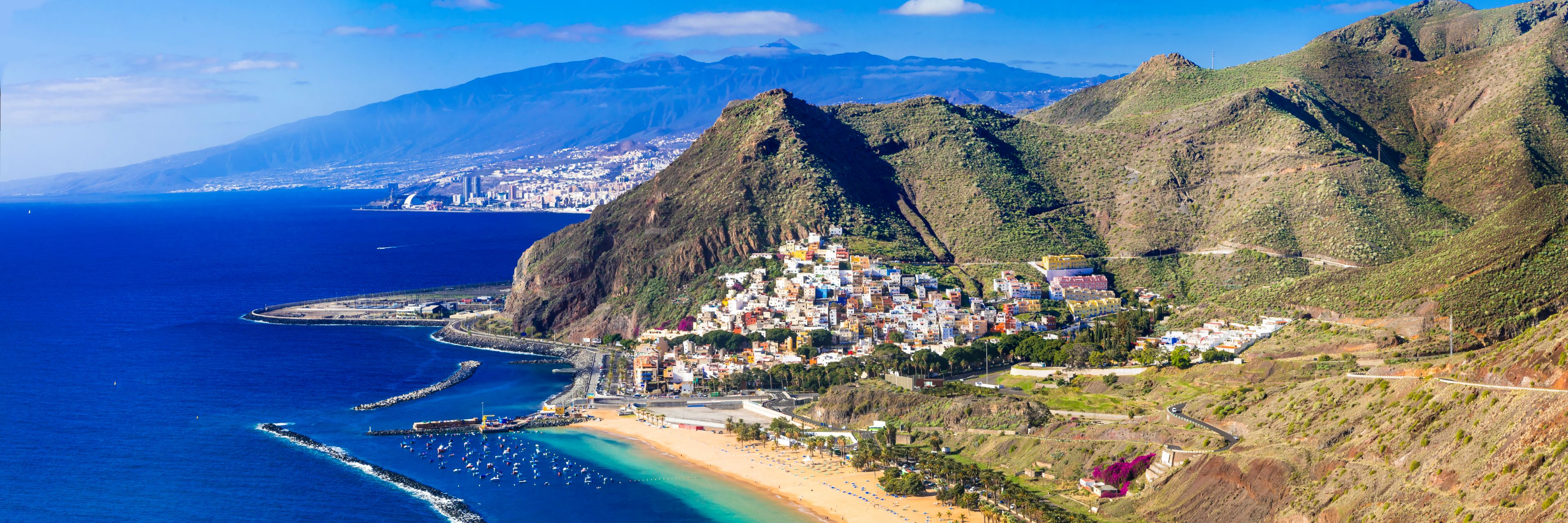 Aerial view of island and sandy beach.