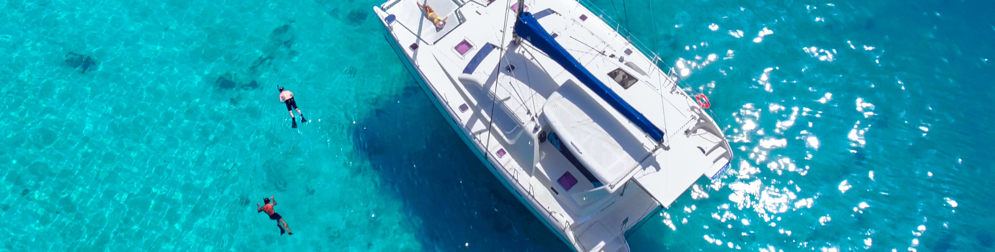 Sail boat anchored in the ocean. 