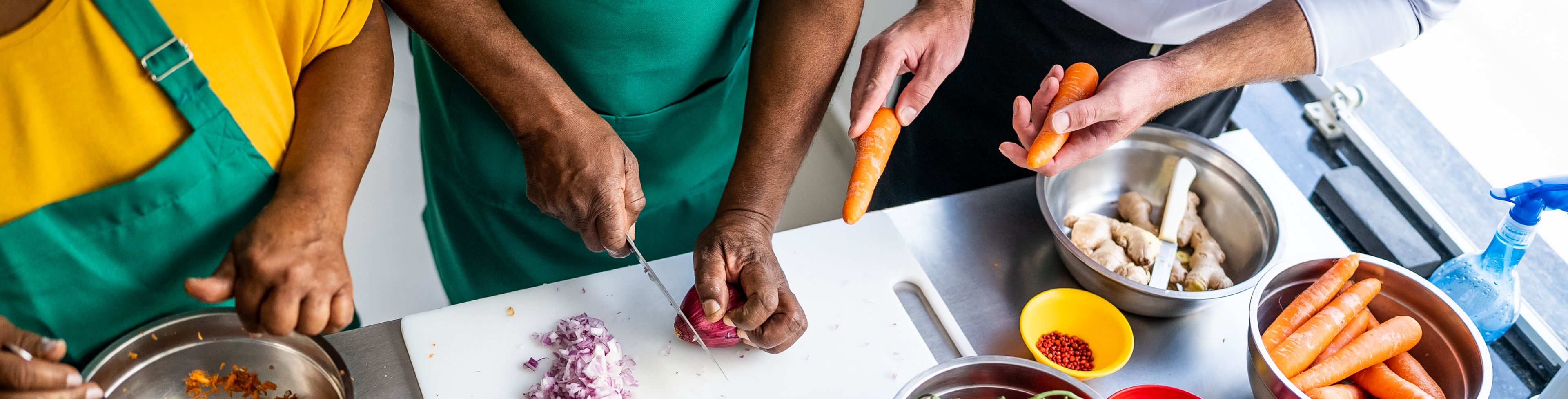 Chefs preparing and cooking food.