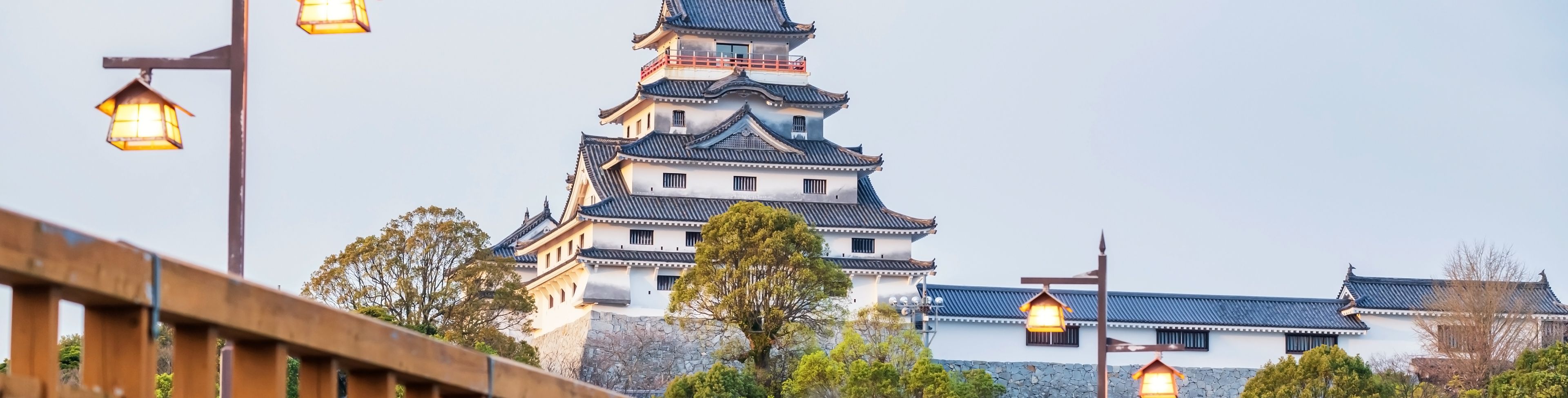 Bridge leading to a large temple in the distance. 