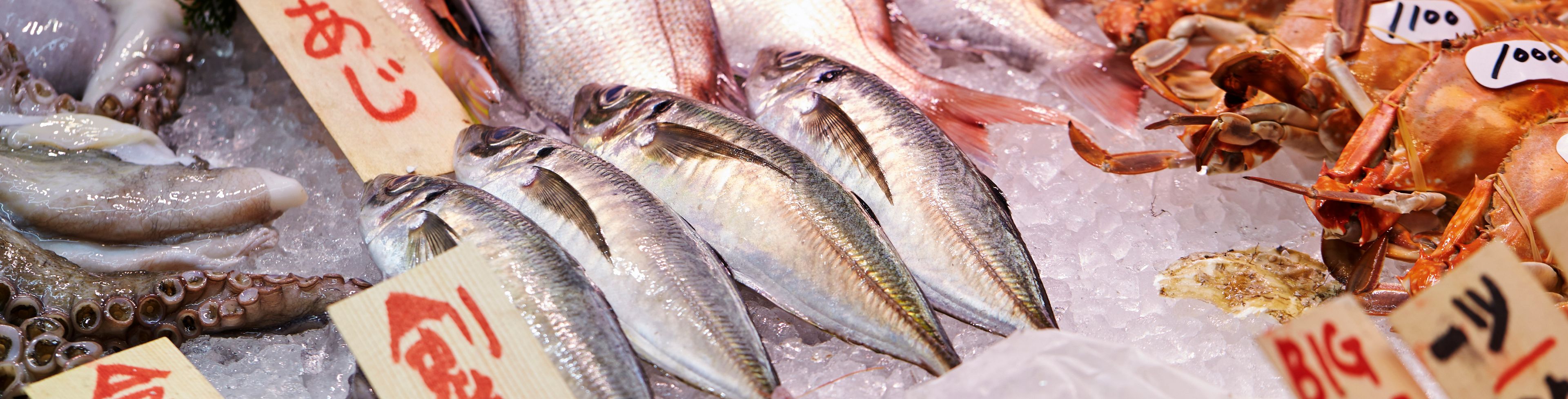 Fish and crabs on ice in a market. 