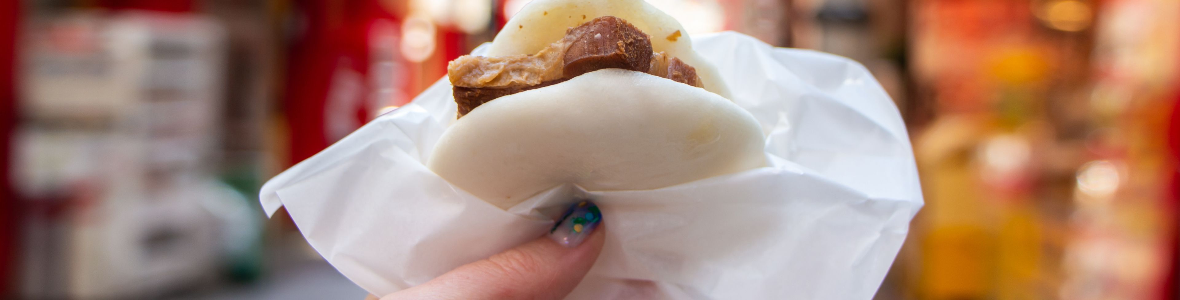 Sandwich in hand. 