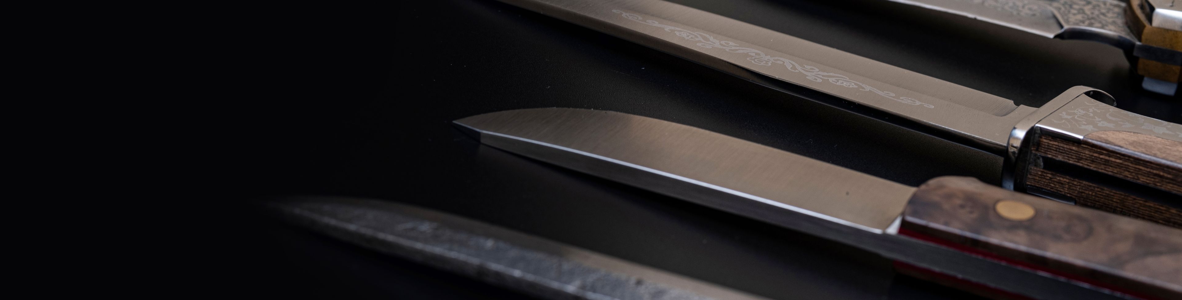 Knives on a black table. 