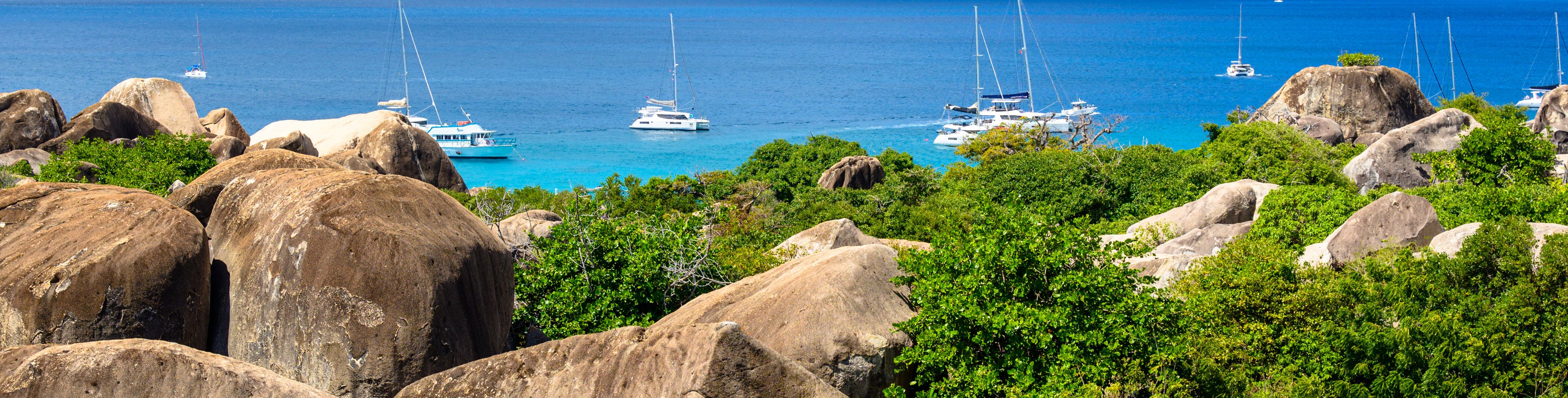 Ocean view of the island of boats sailing. 