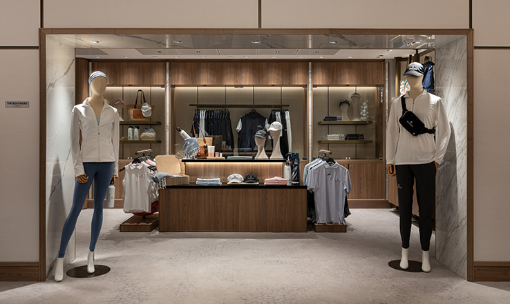 Store front with clothing options and mannequins. 
