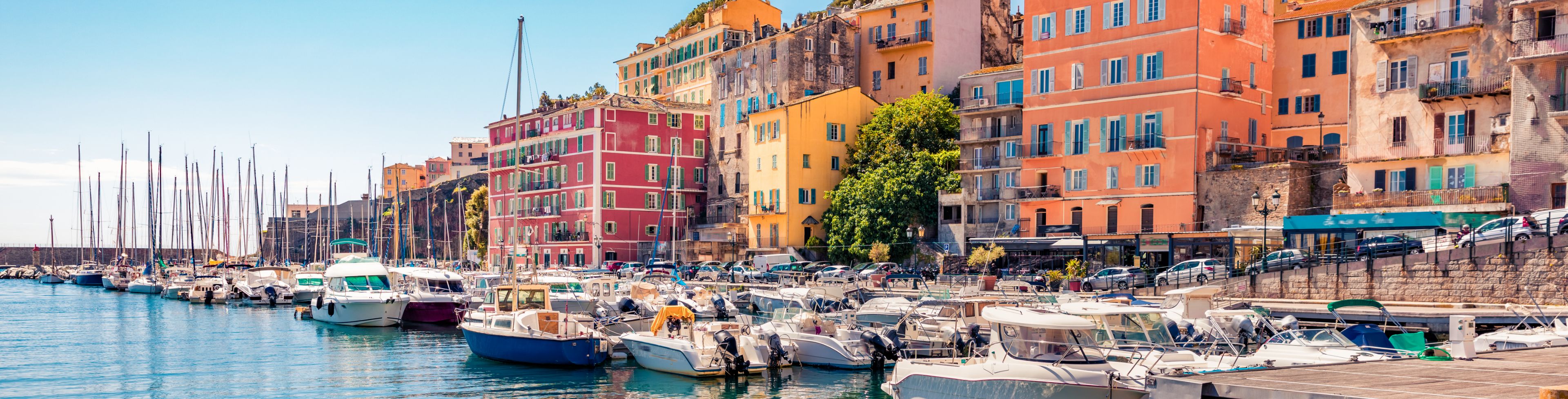Bastia marina along some older buildings. 