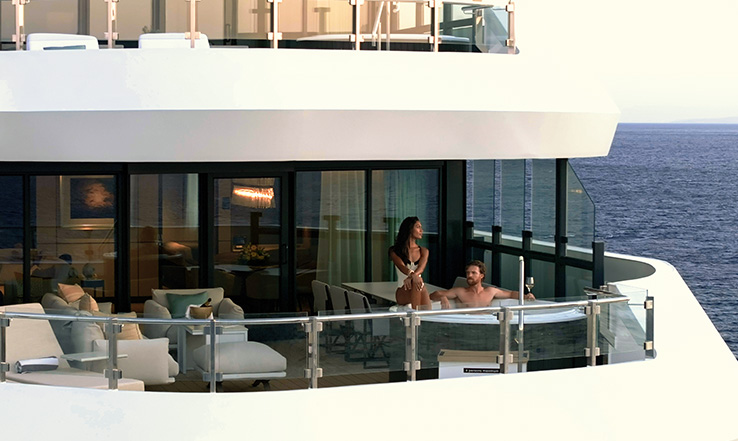 Man and woman enjoying a hot tub on a private deck. 