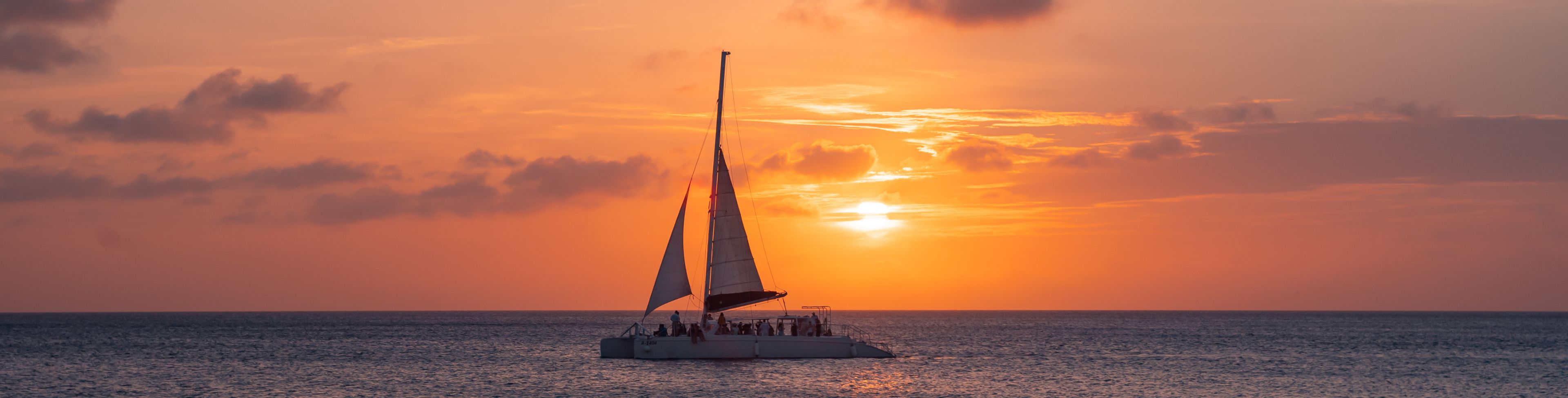 Sailboat on the sea at sunset.