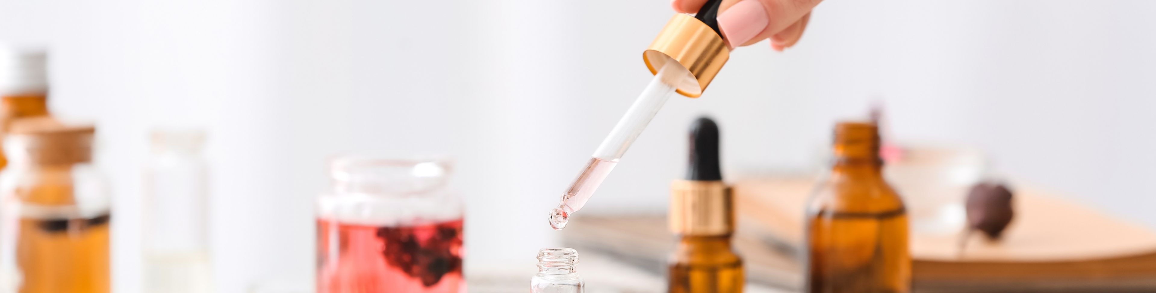 A variety of bottle full oils and fragrances.