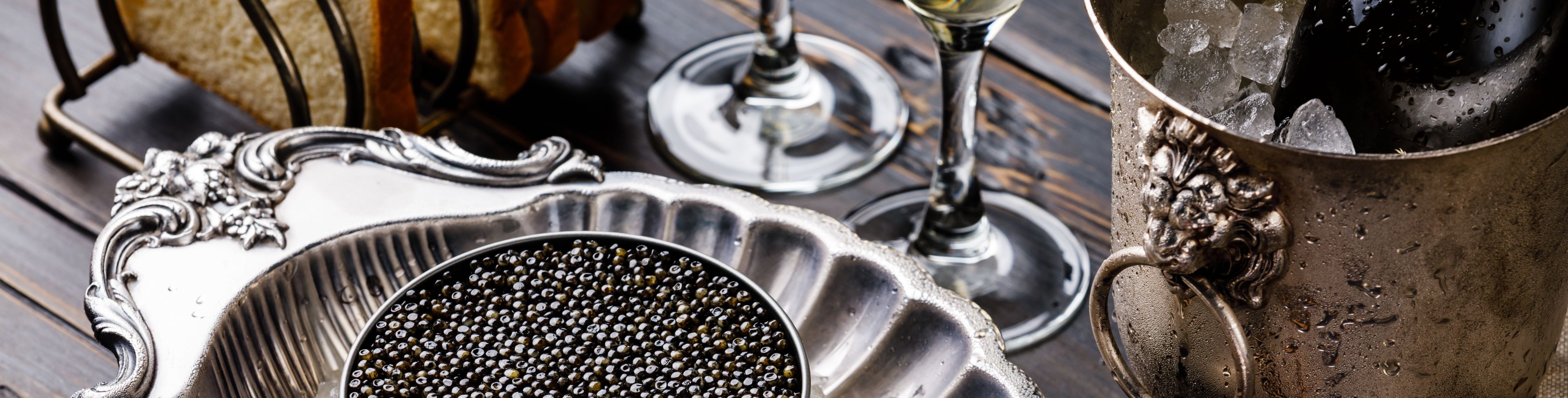 Caviar plated with a spoon beside it.