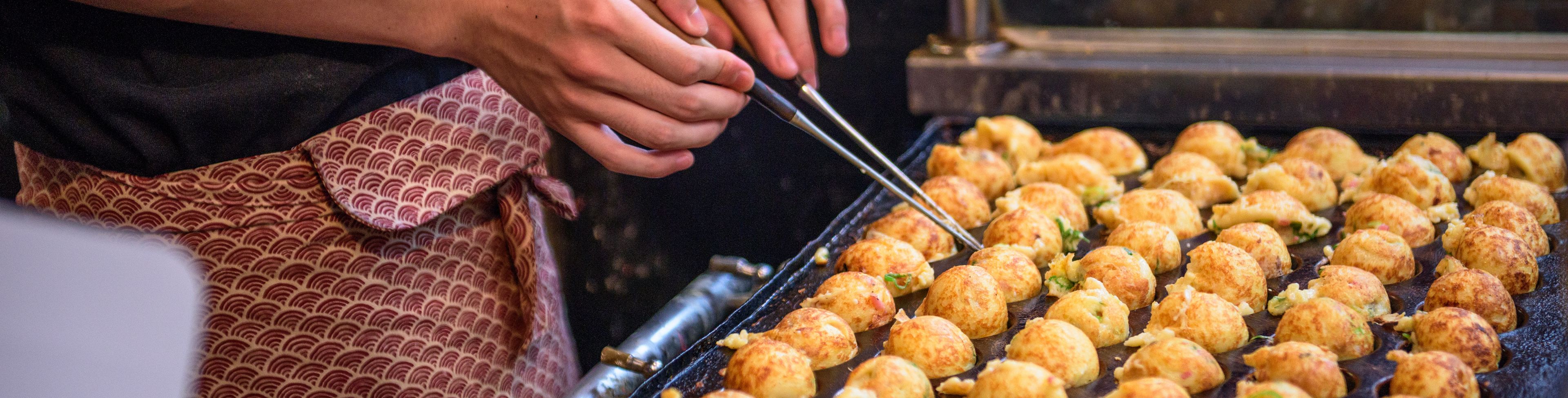 Chef cooking food on a grill. 
