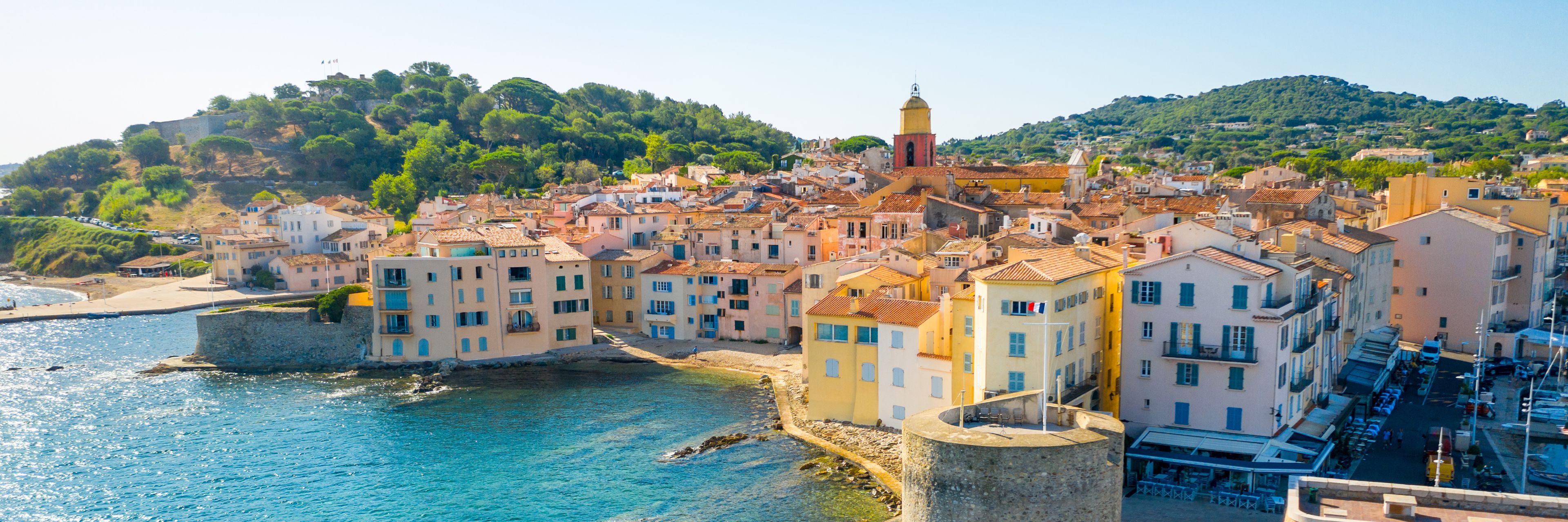 City buildings overlooking the ocean.