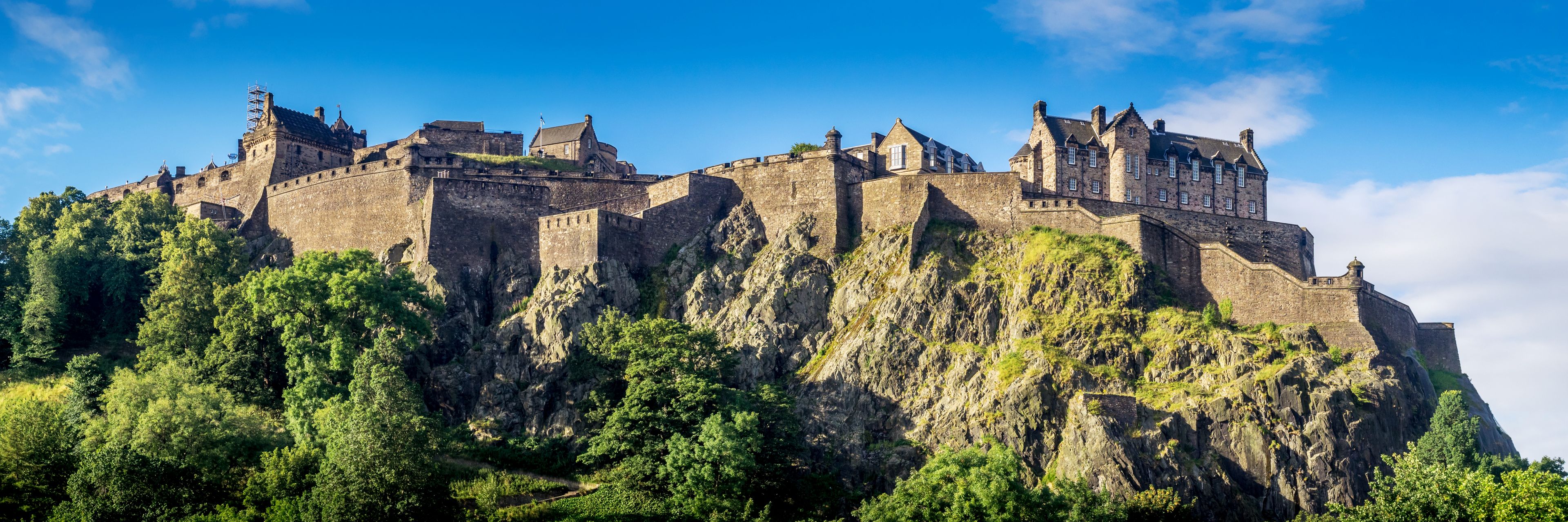Castle overlooking cliffs and nature.