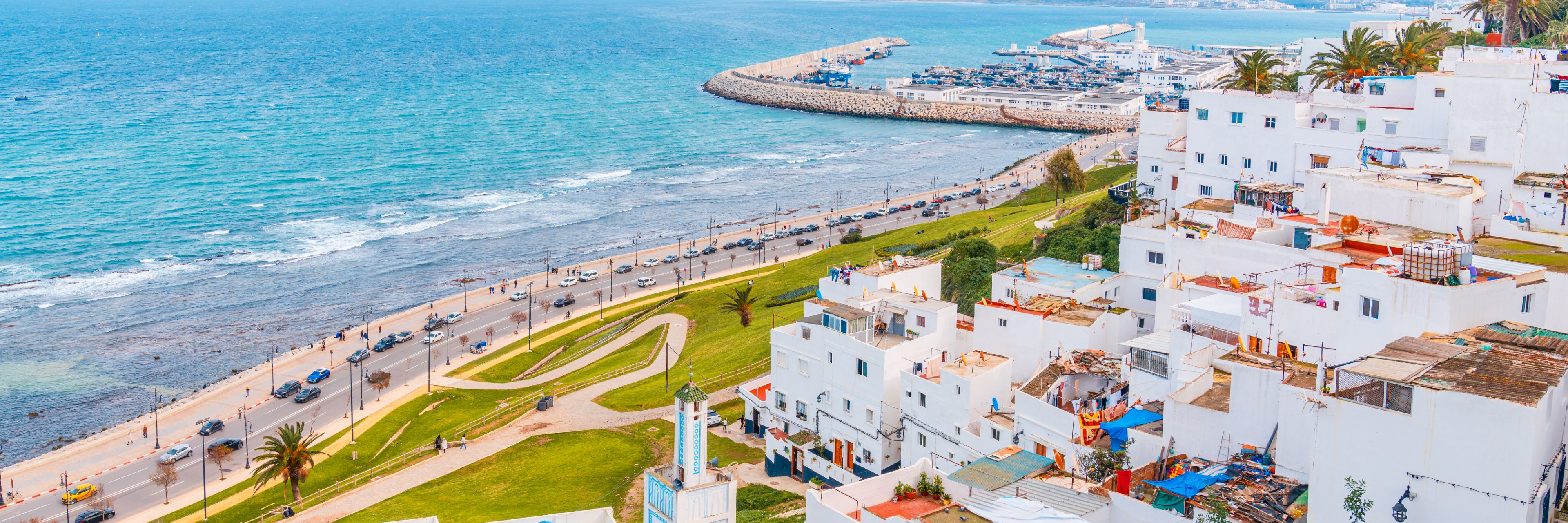 City overlooking the ocean and beach.