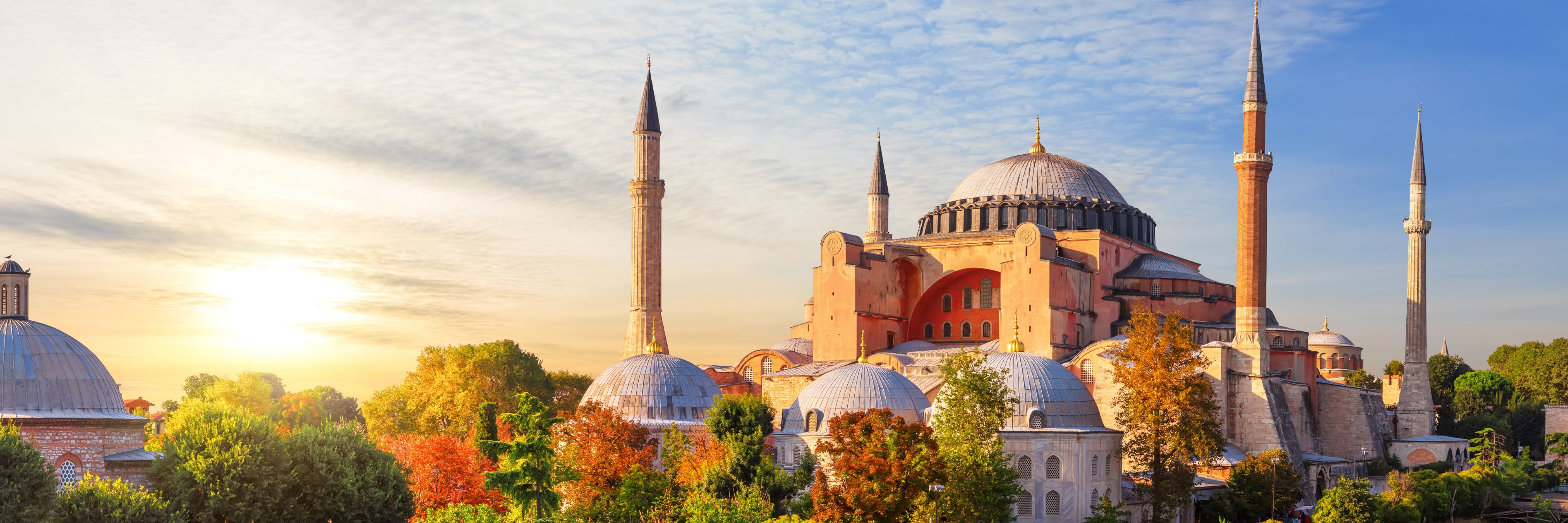 Hagia Sophia in Istanbul at sunrise with its massive central dome and tall minarets