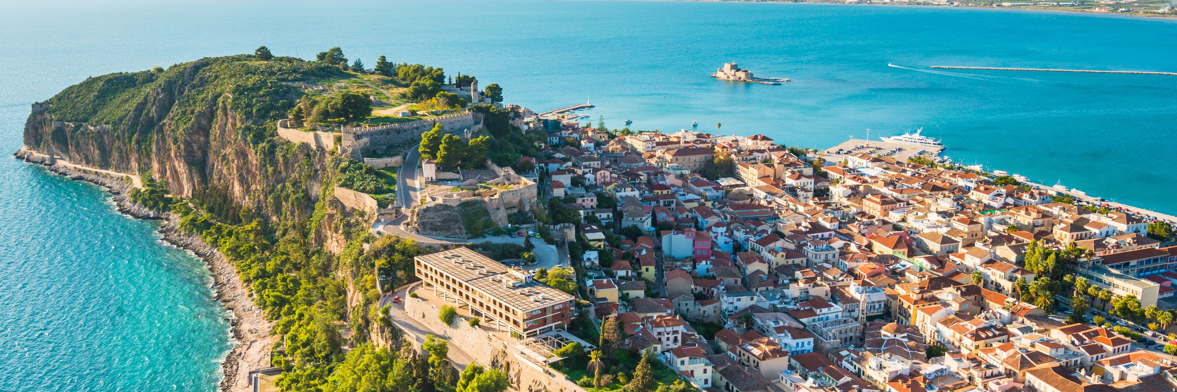 Aerial view of the city surrounded by the ocean.